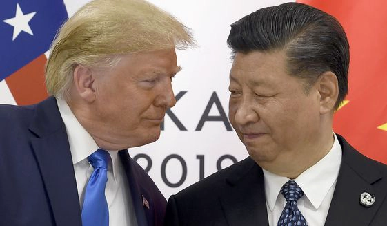 In this June 29, 2019, file photo, President Donald Trump, left, meets with Chinese President Xi Jinping during a meeting on the sidelines of the G-20 summit in Osaka, Japan. China has announced it will raise tariffs on $75 billion of U.S. products in retaliation for President Donald Trump's planned Sept. 1 duty increase in a war over trade and technology policy. (AP Photo/Susan Walsh, File)