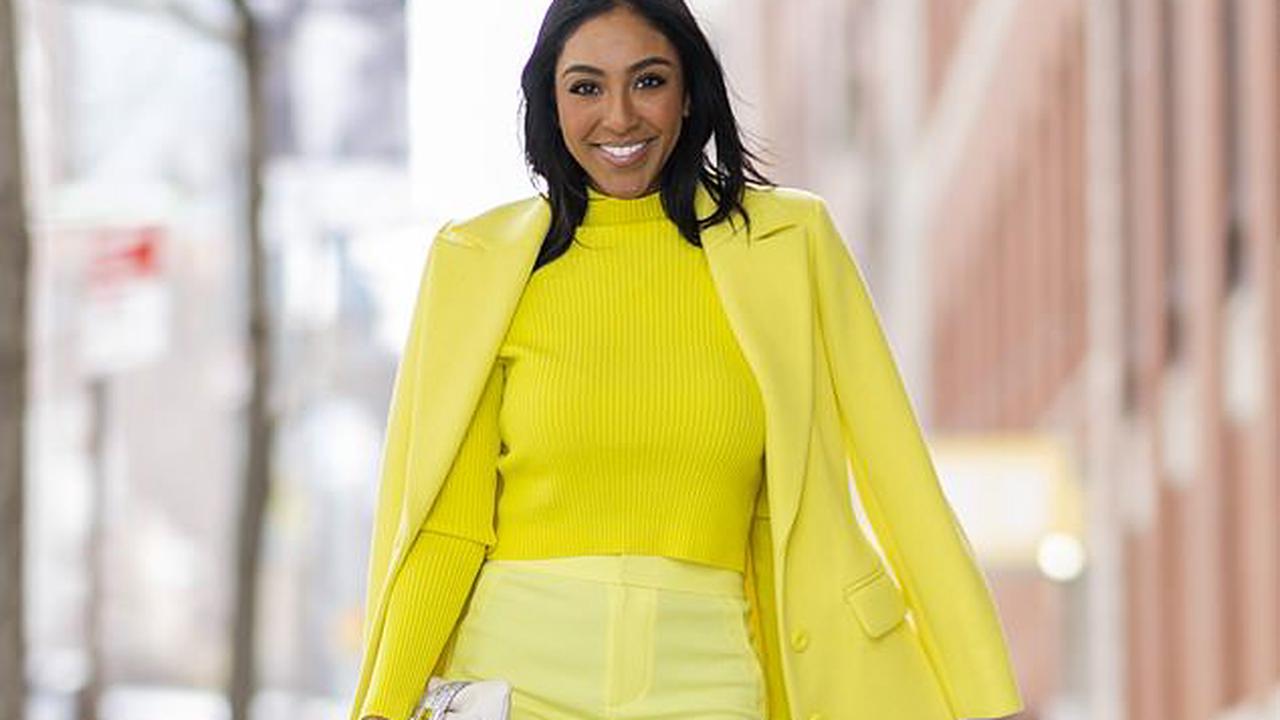 Bachelorette's Tayshia Adams stands out in a bright yellow jacket and white Jimmy Choo shoes in New York City