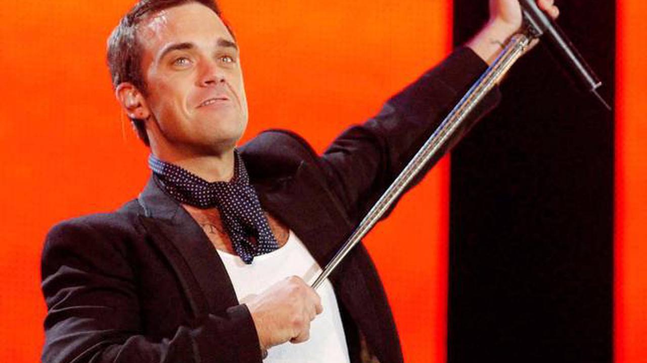 Robbie Williams dit qu'un tueur à gages a été embauché pour le tuer au sommet de sa renommée