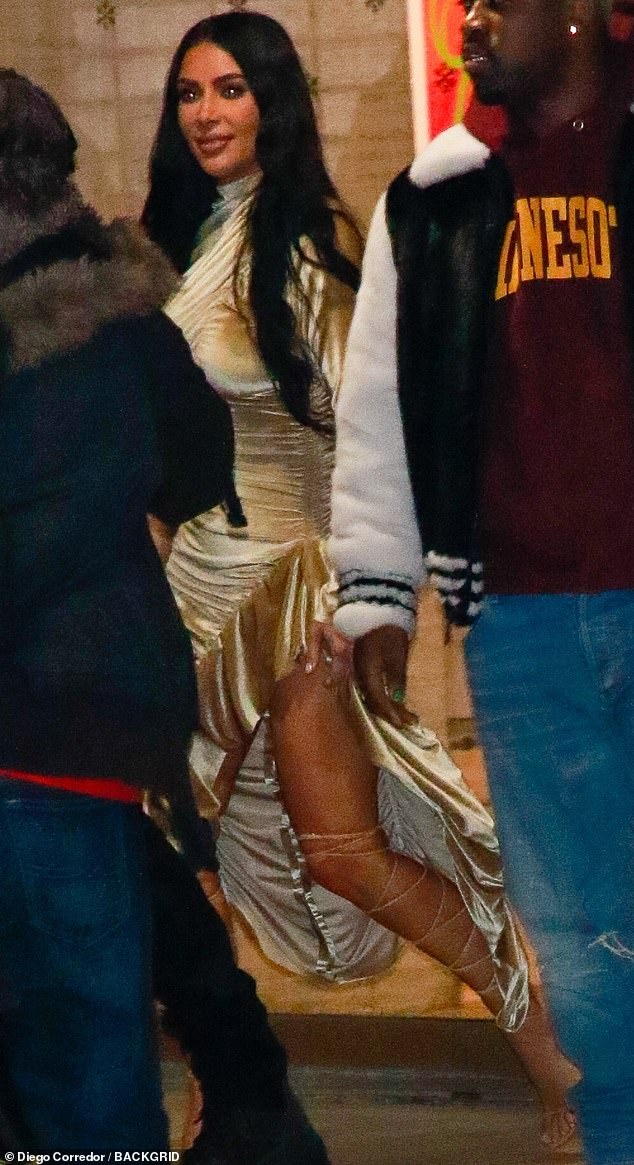 Regal robes: North solidified her status as a rising fashion icon in a fuzzy white robe, tied at the waist