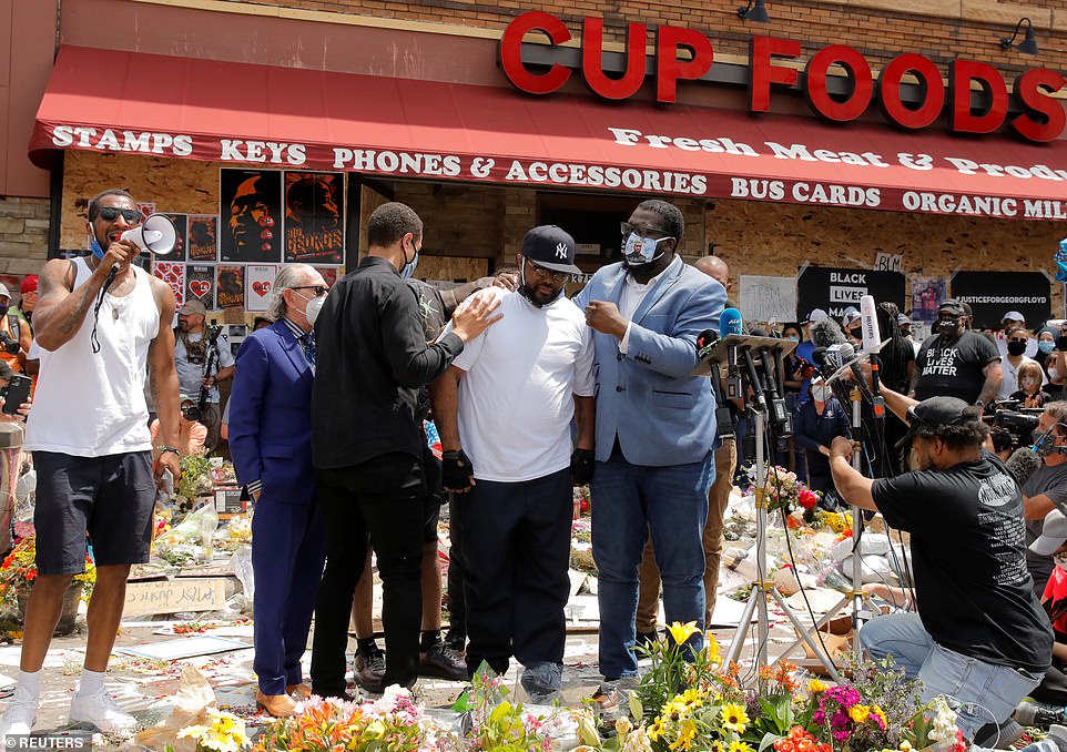 Terrence Floyd, brother of George Floyd, reacts at a makeshift memorial honoring his sibling