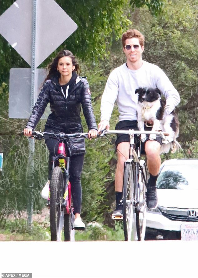 Dog mom: The brunette beauty put on a leggy display, as she flaunted her legs in a pair of pastel tie-dye shorts and a matching sweatshirt