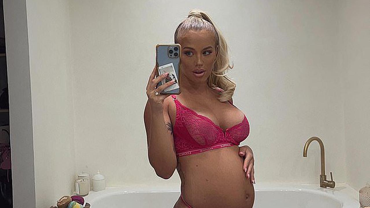 Tammy Hembrow flaunts her growing baby bump in racy pink lingerie as she prepares to welcome her first child with fiancé Matt Poole