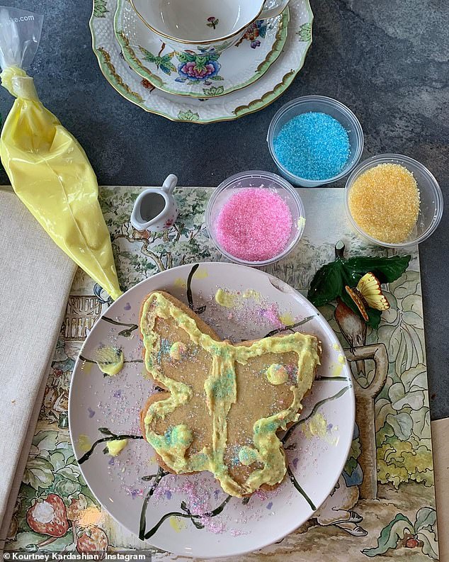 Decorating: Sharing a butterfly frosted cookie they also seemed to enjoy the holiday decorating treats with icing and sprinkles