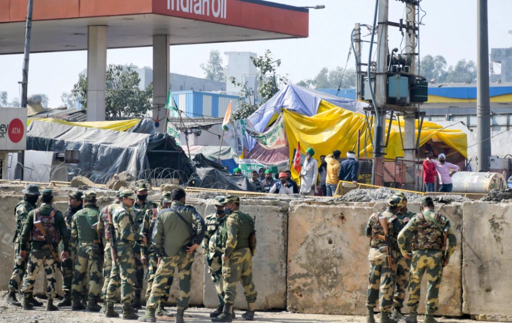 Police Personnel Behind Cemented Barricades Pti