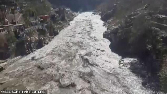 At least 200 people are missing and nine killed after mountain glacier crashed into dam and triggered massive flood in India?(photos)