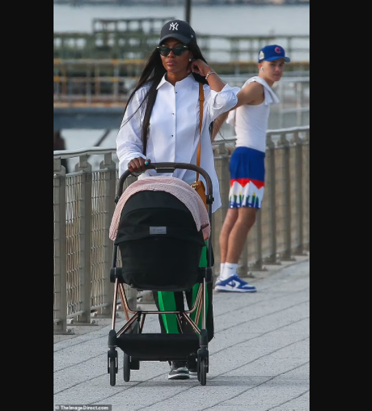 Supermodel Naomi Campbell, 50, is seen in public with her newborn daughter for first time (photos)