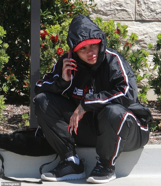 Despite seeming fine before entering the bank, 'when she left she was arguing loudly with someone on her iPhone, she even had tears coming down her face,' a source told DailyMail.com