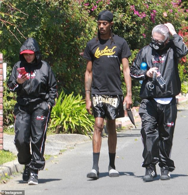 DailyMail.com has also learned that Chyna has refused to go without her glam squad during the coronavirus lockdown and is having her beauty entourage quarantine with her. The 31-year old model and entrepreneur was spotted out and about on Tuesday, accompanied by two men who work for her Lashed Cosmetics line, both wearing 'Lashed' logo shirts (pictured)