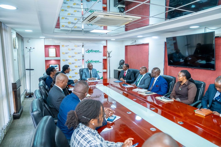 May be an image of one or more people, newsroom, dais and text