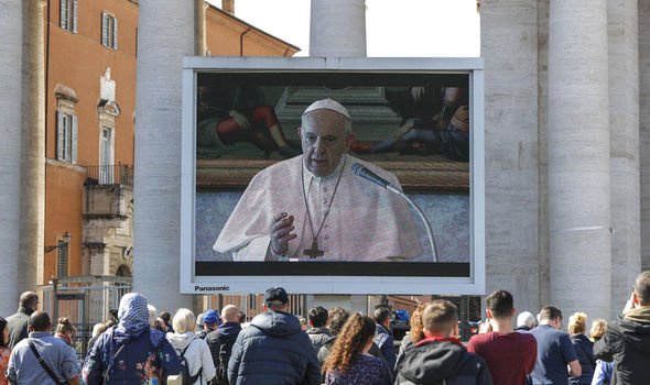 Most kept a safe distance from each other as they watched the pope