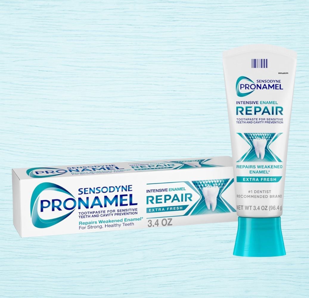 Sensodyne ProNamel Repair toothpaste for sensitive teeth. Tube and box shown. Highlights: enamel repair, cavity prevention