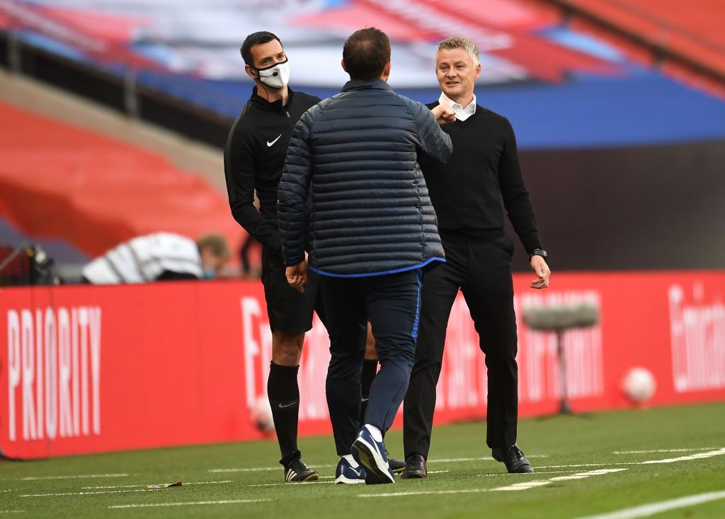 LONDON, ENGLAND - JULY 19: Frank Lampard, Manager of Chelsea interacts with Ole Gunnar Solskjaer, Manager of Manchester United after the FA Cup Semi Final match between Manchester United and Chelsea at Wembley Stadium on July 19, 2020 in London, England. Football Stadiums around Europe remain empty due to the Coronavirus Pandemic as Government social distancing laws prohibit fans inside venues resulting in all fixtures being played behind closed doors. (Photo by Andy Rain/Pool via Getty Images)